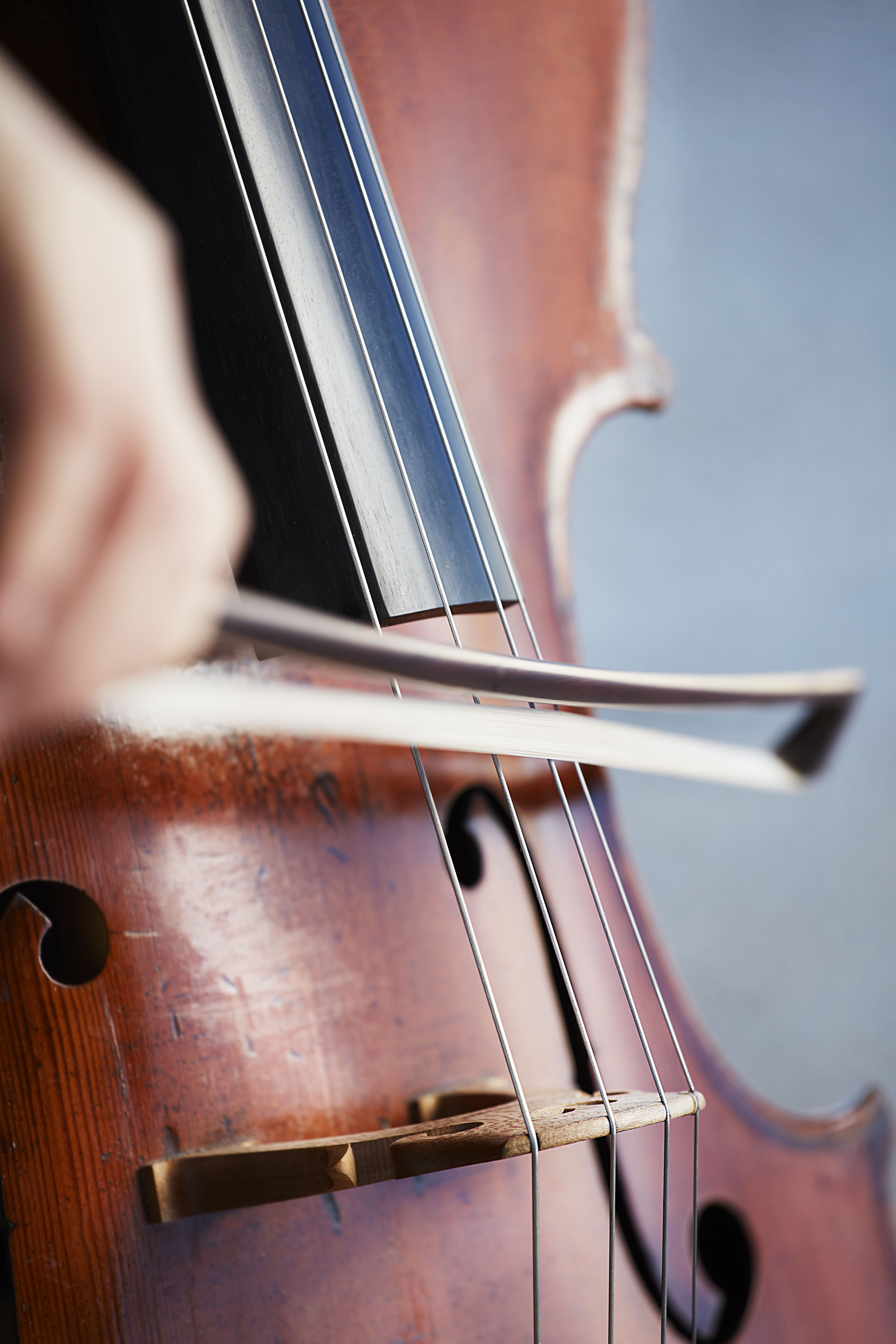 cellist-player-hands-violoncellist-playing-cello-background-field-musical-art-concept-passion-music-classical-music-professional-cello-player-solo-perform.jpg